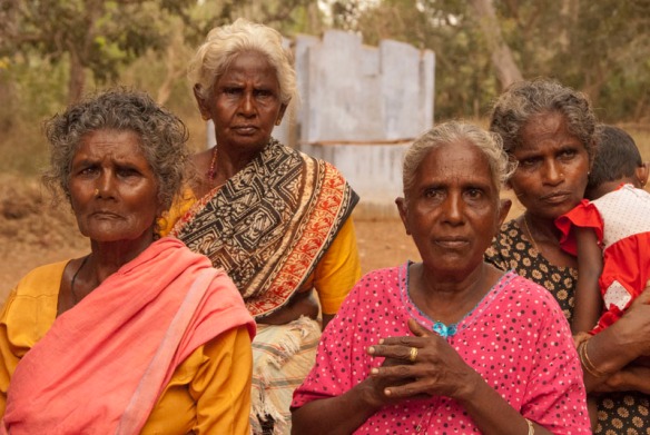 Ladies at Jeyapuram with faces that bear the scars of their suffering attend the IDP resttlement meeting. Jeyapuram, Sri Lanka. Photograph©Chulie de Silva